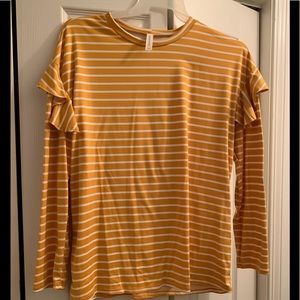 Popular gold colored, ruffle sleeved blouse.